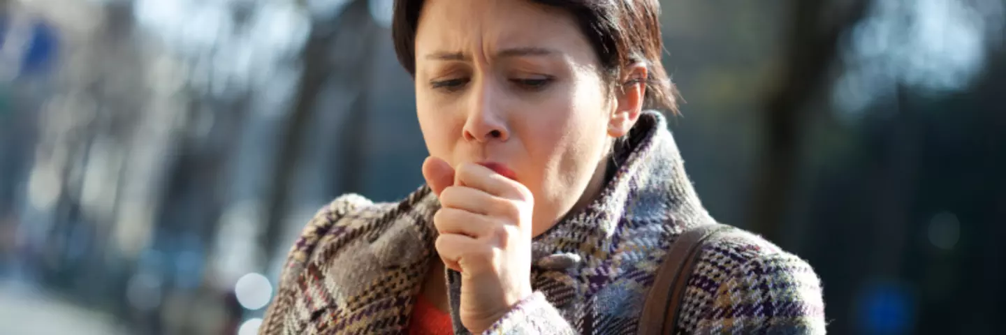 Header, hustende Frau